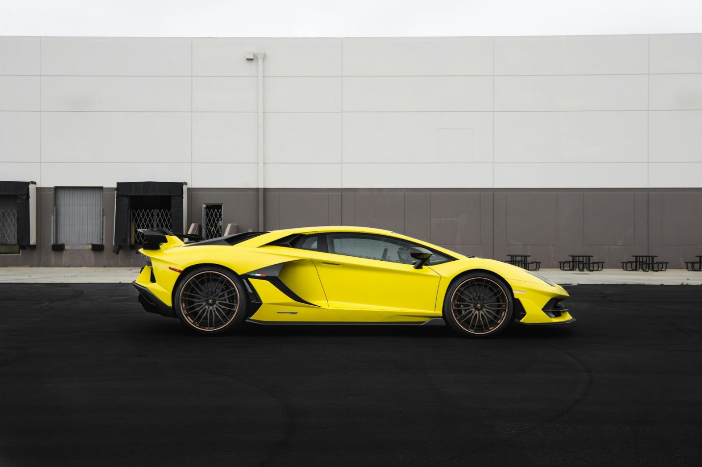 yellow lamborghini on the road