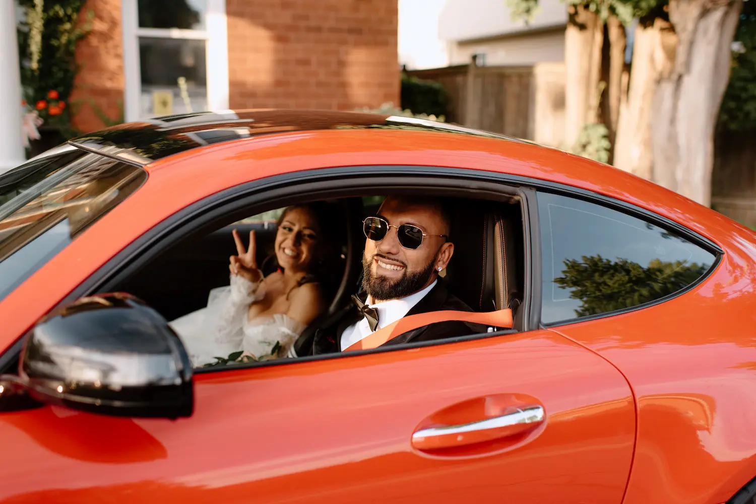 just-married-couple-celebrates-in-a-red-super-car